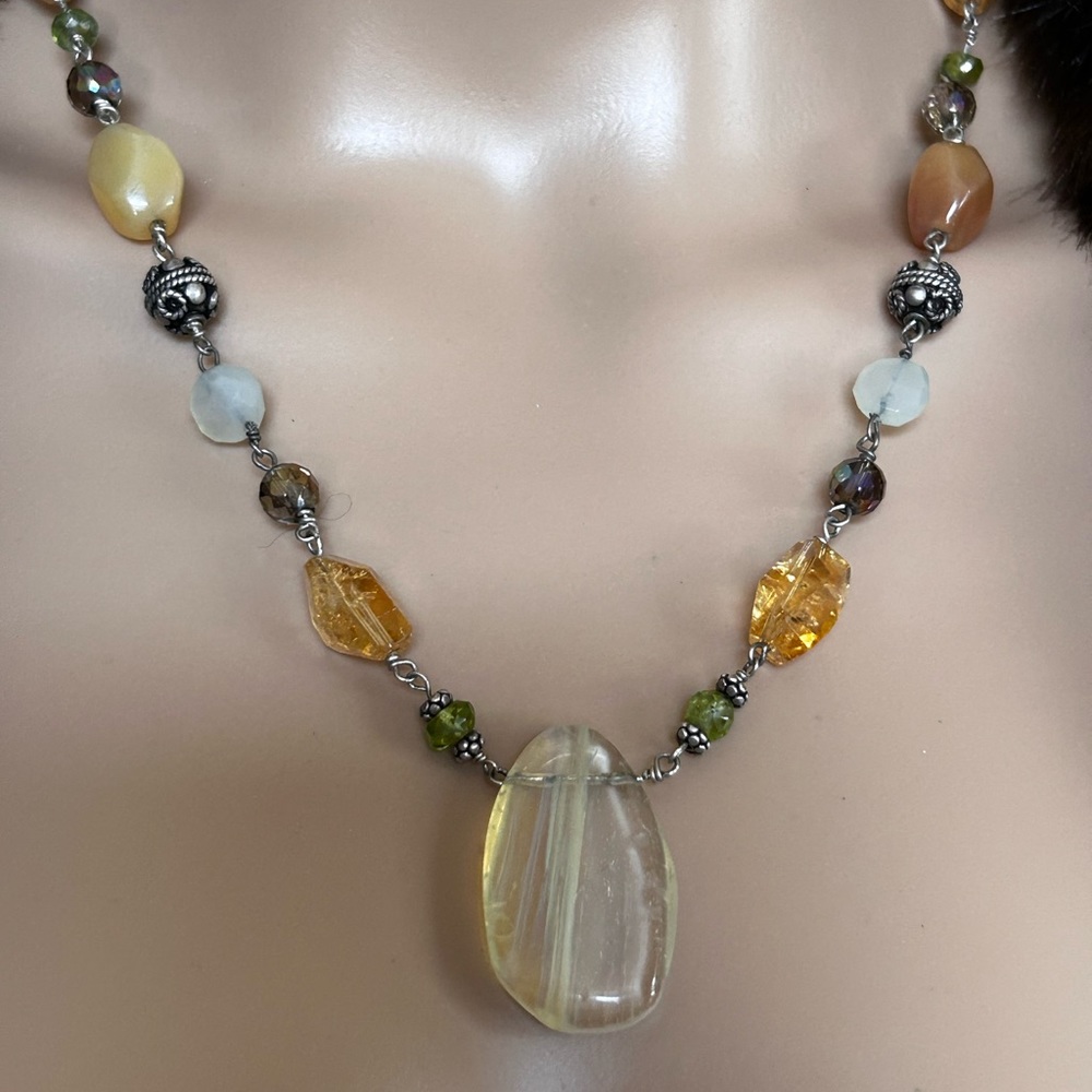 Necklace with semi-precious stones and 2 sterling silver beads.